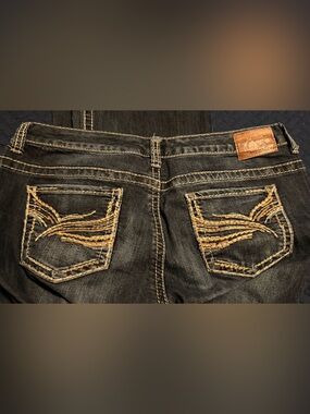 Maurices Dark Blue Boot Cut Jeans with Tan Stitching